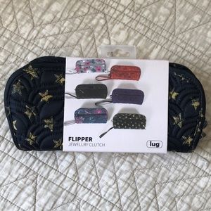 Brand new Lug flipper jewelry clutch